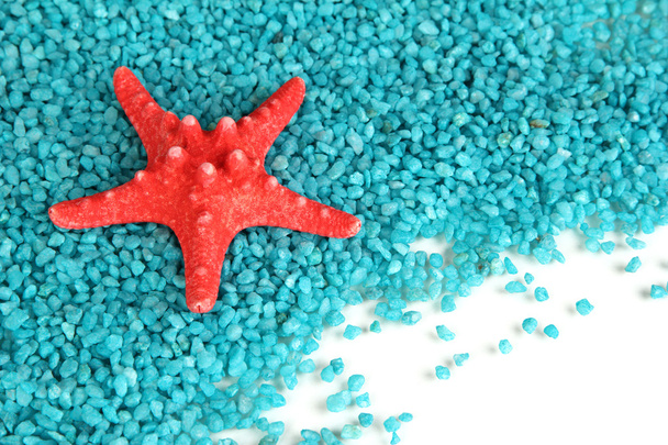 Starfish on blue crystals of sea salt background - Fotoğraf, Görsel