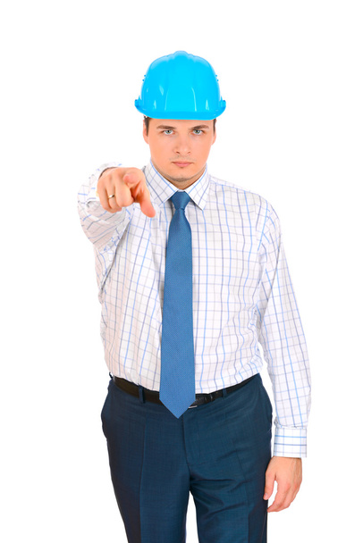 Businessman with blue hard hat pointing the finger - 写真・画像