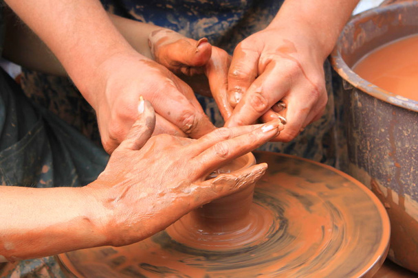 Hands of a potter close-up - Photo, Image