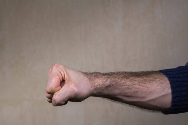 Man fist clenched in anger. Violence and aggression concept. - Photo, Image