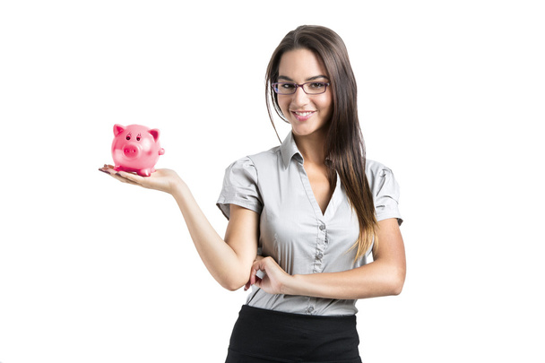 Woman holding a piggy bank - Foto, imagen