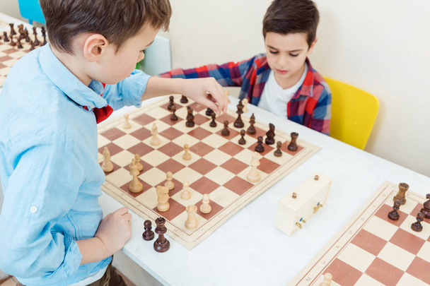 Two boys playing chess in tournament as sport - Foto, Imagem