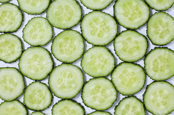 Fresh green slices cucumbers background - Fotografie, Obrázek