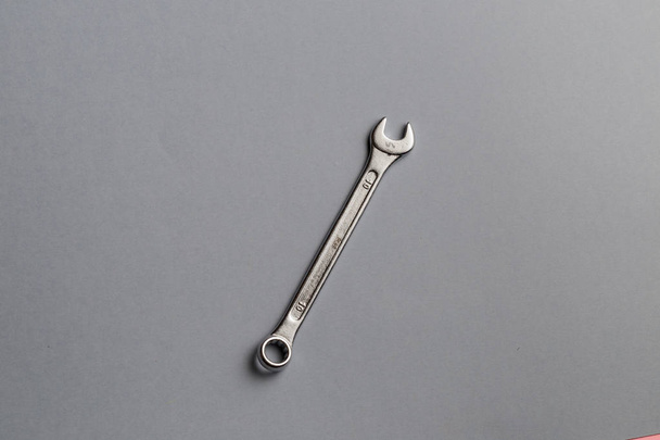 Wrench isolated on gray background. useful tool for a mechanic - Foto, Imagem