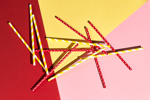 a pile of creative straws on the table - Фото, изображение