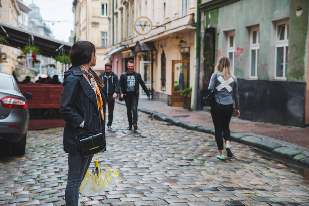 LVIV, UKRAINE - June 14, 2018: people walking by old european street of town - Фото, зображення