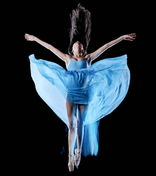 young woman ballet dancer dancing isolated black background light painting - Foto, immagini