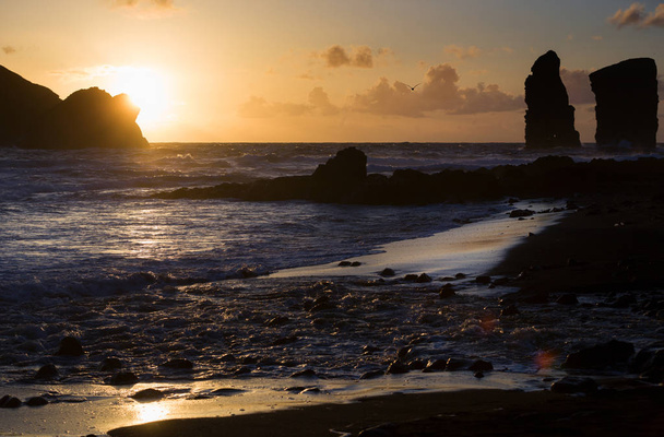 Beautiful sunset next to the sea shore in Mosteiros, Azores, Portugal - Zdjęcie, obraz