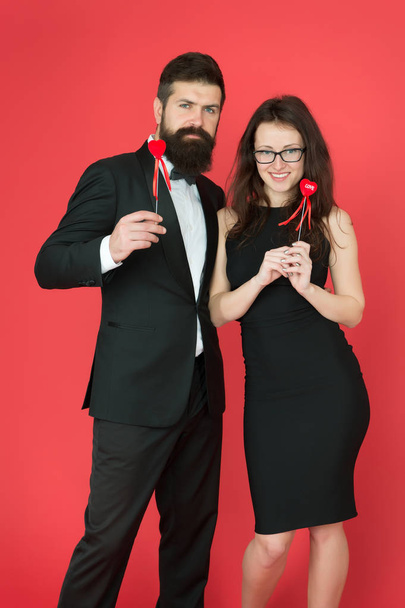 formal couple. business meeting. tuxedo man and formal woman at formal party. sexy couple in love. valentines day heart. bearded businessman with formal lady. love date and romance. business couple - Φωτογραφία, εικόνα