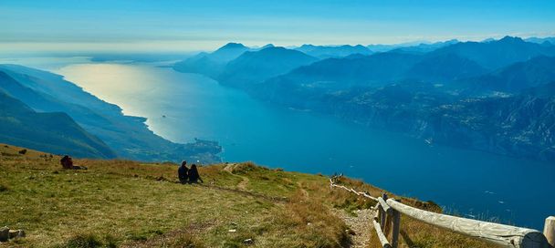 View of the Lake Garda from Monte Baldo, Italy.Panorama of the gorgeous Garda lake surrounded by mountains in the autumn - Photo, image