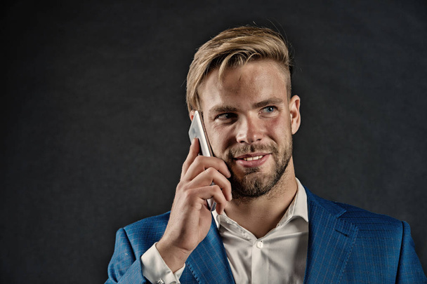 Happy man talk on smartphone. Businessman smile with mobile phone. Business lifestyle concept. Business communication and new technology, vintage - Photo, Image