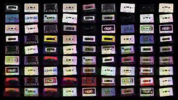 Changing abstract pattern of cassette tapes on black background - Footage, Video