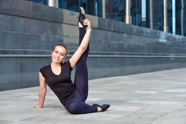 Stretching fit or dancer or fitness woman doing exercise - Photo, Image