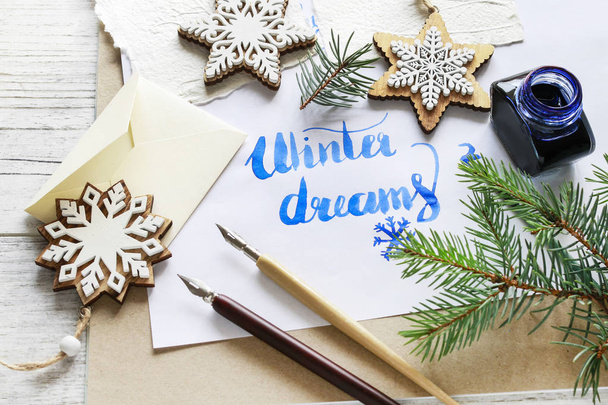 Winter dreams - calligraphy, handwritten letters on white paper. - Fotoğraf, Görsel
