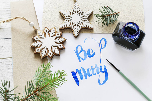 Be Merry - calligraphy, handwritten letters on white paper. - Zdjęcie, obraz