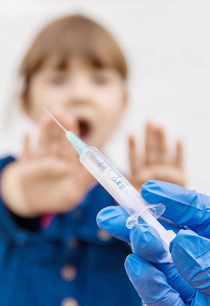 vaccination of children. An injection. Selective focus. - 写真・画像