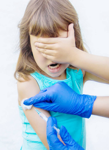 vaccination of children. An injection. Selective focus. - 写真・画像
