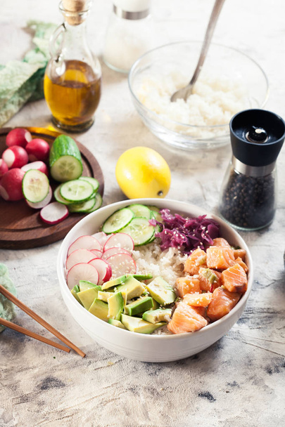 Poke bowl, traditional Hawaiian raw fish salad - Fotó, kép