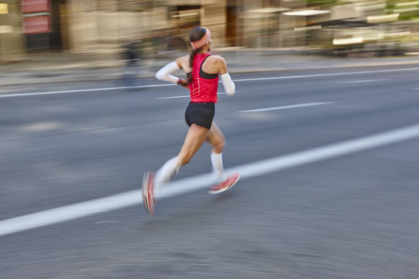 Marathon runner in motion on the street. Healthy lifestyle.  - Photo, Image