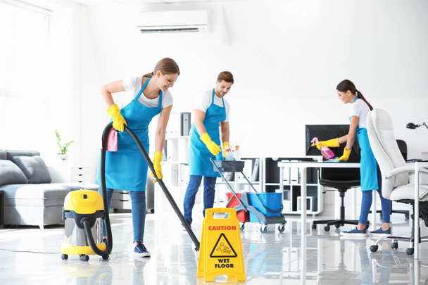Team of janitors cleaning office - Photo, image