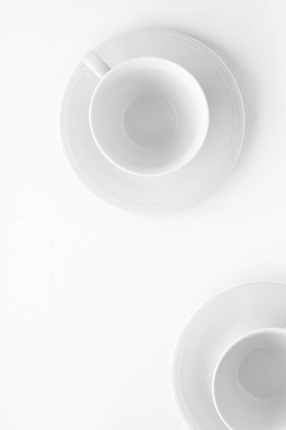 Empty cup and saucer mockup on white background, flatlay - Fotoğraf, Görsel