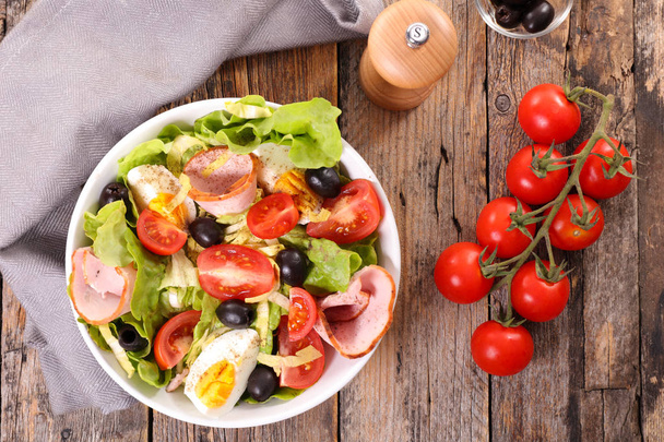 bowl of mixed salad with egg, ham and tomato - Photo, image