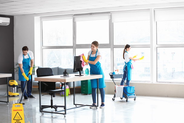 Team of janitors cleaning office - Photo, Image