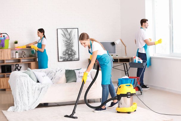 Team of janitors cleaning flat - Фото, зображення