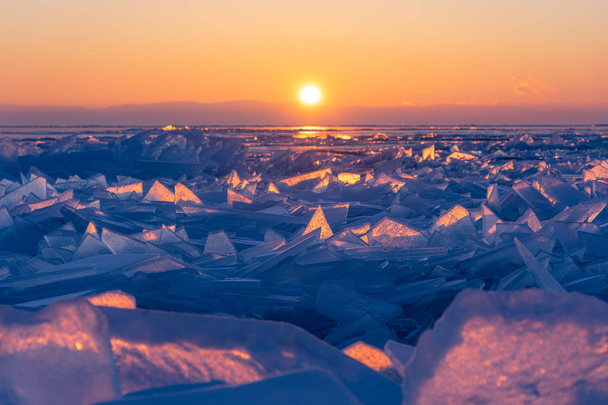 Sunrise at Baikal frozen lake in winter season, Olkhon island, S - 写真・画像