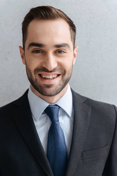 Image closeup of young businessman 30s in formal suit and tie sm - Fotó, kép