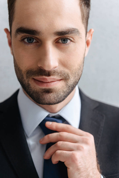 Image closeup of confident businessman 30s in formal suit touchi - Foto, Imagen