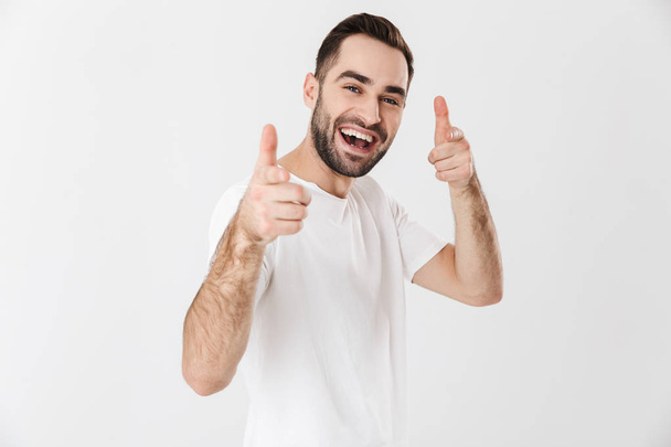 Handsome cheerful man wearing blank t-shirt - Фото, изображение