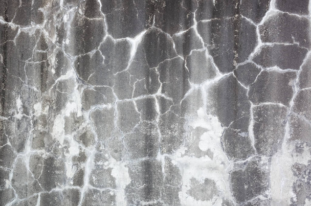 weathered gray wall with cracks - 写真・画像