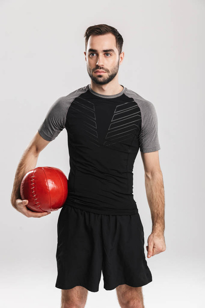 Confident motivated sportsman doing exercises - Valokuva, kuva