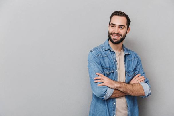Excited cheerful man wearing shirt standing isolated - Photo, Image