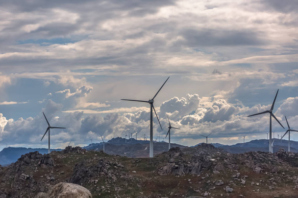 View of a wind turbine on top of mountains - Photo, Image