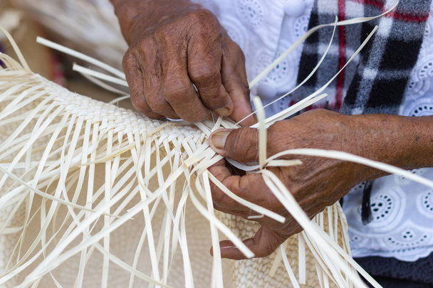 The villagers took bamboo stripes to weave - Photo, Image