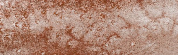 panoramic shot of brown colorful watercolor paint spill on textured background  - Photo, Image