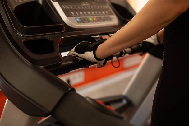 Closeup shot of woman on treadmill at gym - Photo, Image