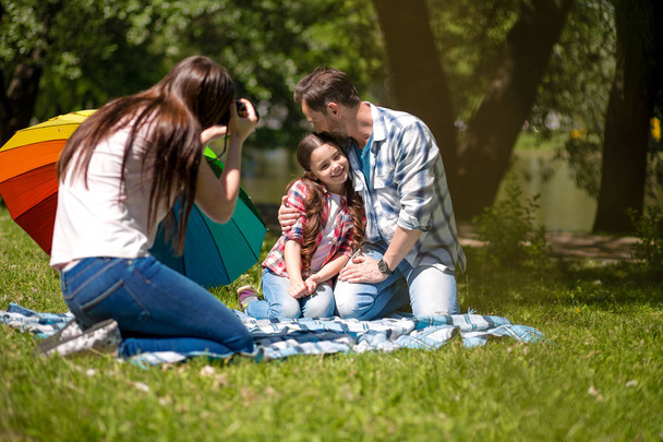 Happy family enjoying time in summer park - Zdjęcie, obraz