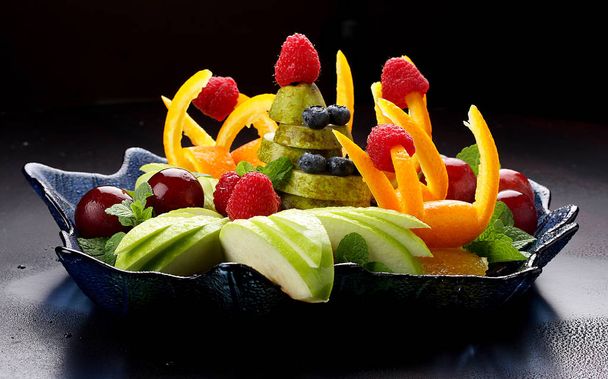Fruit salad on a dark background. - Photo, Image