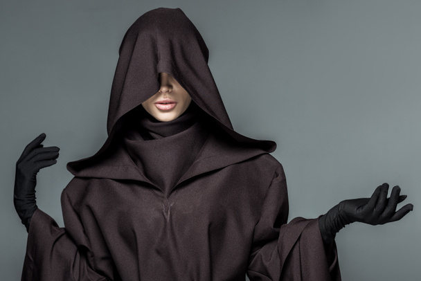 front view of woman in death costume gesturing isolated on grey - Photo, Image