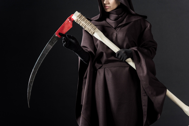 cropped view of woman in death costume holding scythe on black - Photo, Image