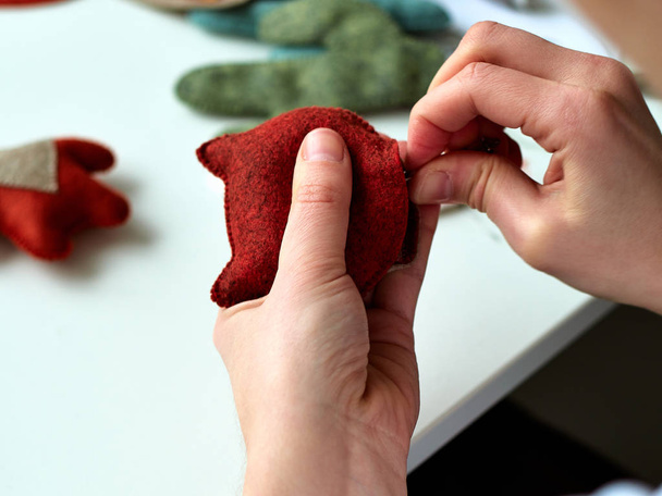 The process of manufacturing toys made of felt, a master of toys. - Photo, Image