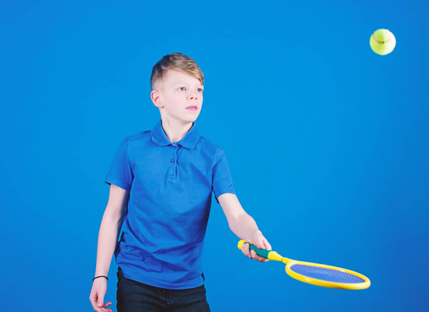Tennis is fun. Gym workout of teen boy. Little boy. Fitness diet brings health and energy. Tennis player with racket and ball. Childhood activity. Sport game success. Happy child play tennis - Photo, image
