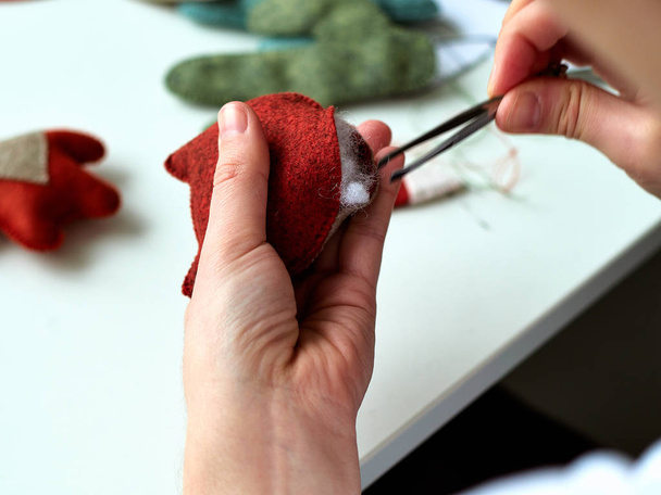 The process of manufacturing toys made of felt, a master of toys. - Photo, image