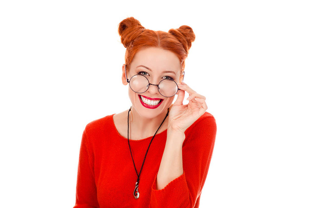 woman in her 30s holding round eye glasses smiling - 写真・画像