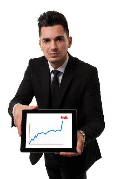 Businessman showing a profit chart on a tablet - Foto, afbeelding