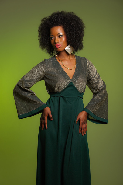 Sensual retro seventies fashion afro woman with green dress. Gre - Foto, afbeelding