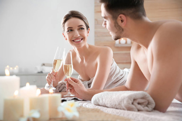 Romantic young couple with champagne in spa salon - Valokuva, kuva